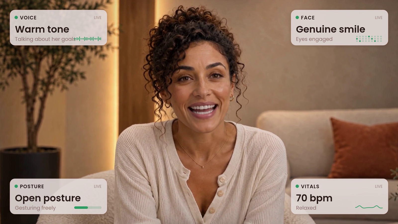 YOUNITY still: the customer smiling while illustrative voice, face, posture, and vitals panels read warm tone and genuine smile